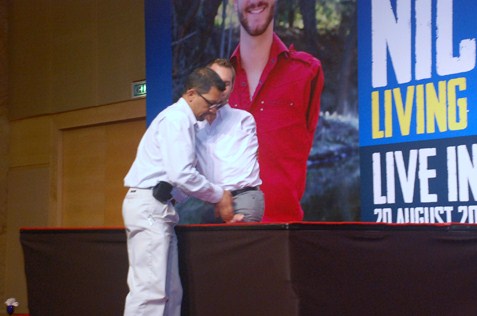 Nick Vujicic is lifted on the stage for his talk