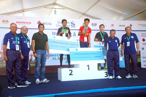 KL Marathon 2013 Malaysia Men category winners Fabian @ Osmond Bin Daimor (1), Shaharudin Bin Hashim (2) and Lim Kien Mau (3)