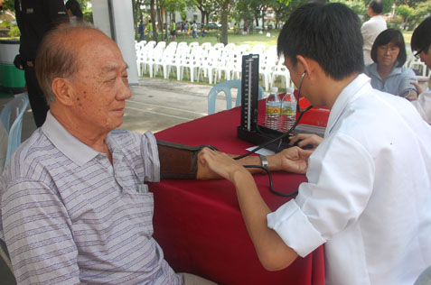 A resident gets his blood pressure checked