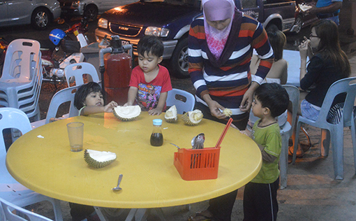A young family enjoying the durians