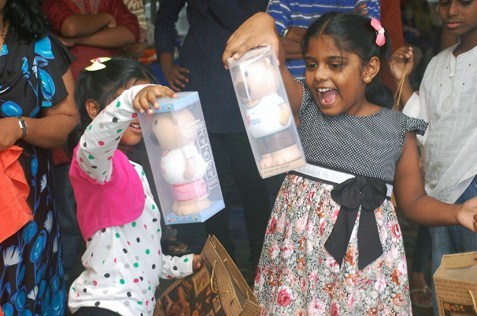 excited children with their winning prizes