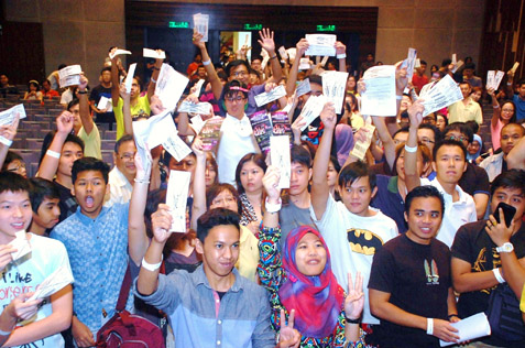Angry K-pop fans waving their tickets to demand their money back for cancelled concert during a briefing by concert organiser Marctensia. 