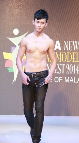 Asia New Star Model 2014 FOM male winner Josh Yen shows off his muscular frame