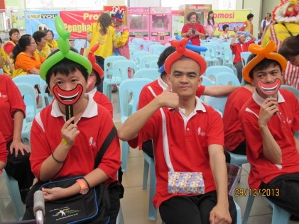 Some of the 15 residents of the Johor Cheshire Home playing with laughter masks