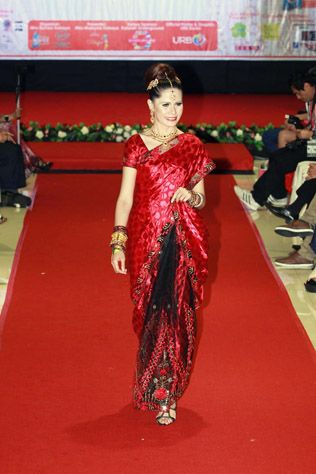 Massuhaella walks the runway in red hot saree