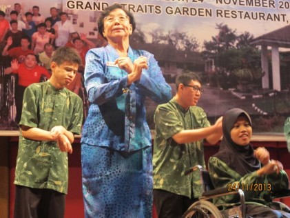 Madam Chong leading the Gangam dance with the residents