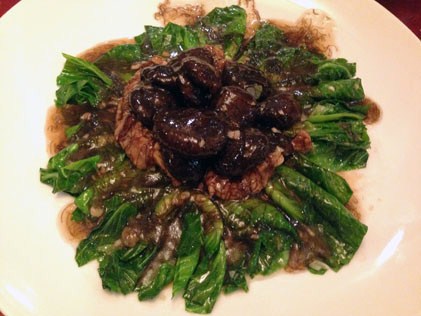 Braised taukan with mushroom in black moss sauce
