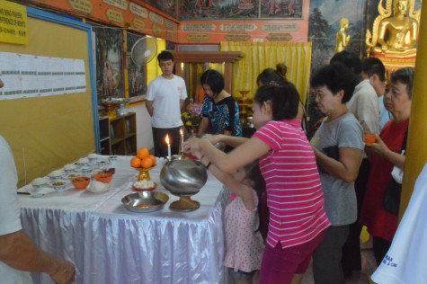 The offering of rice into the alms bowl ceremony