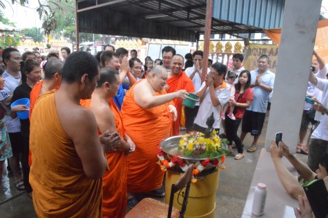 Monks sprinkling onto the Lord Buddha statue