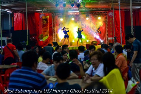 Families book tables at the Festival and prepare Hell Money for the Hungry Ghosts