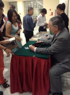 Donoghue autographing his book.
