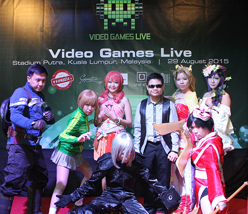 Cosplayers and Alan Cheah (in dark glasses)