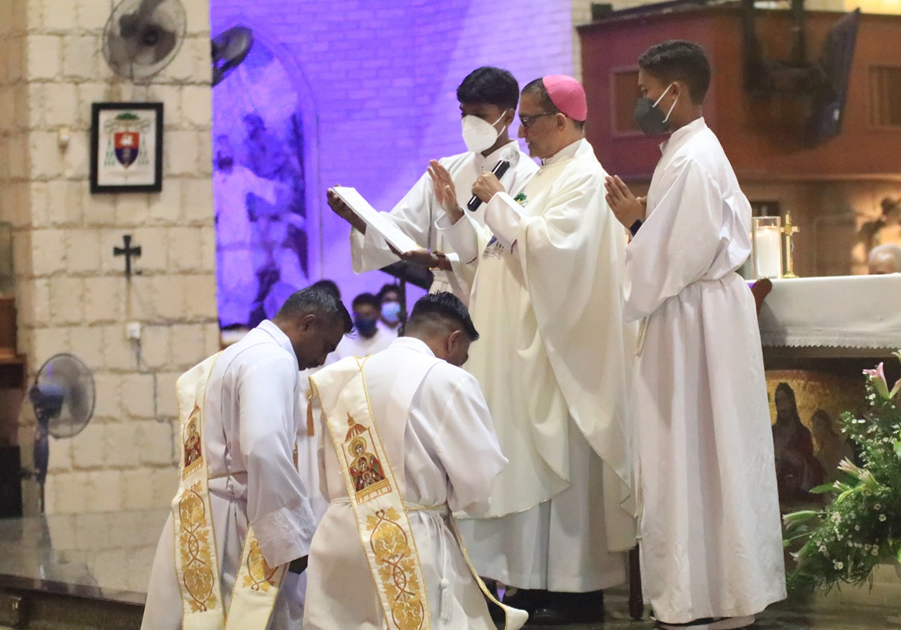 The Bishop of Penang ordains two new priests