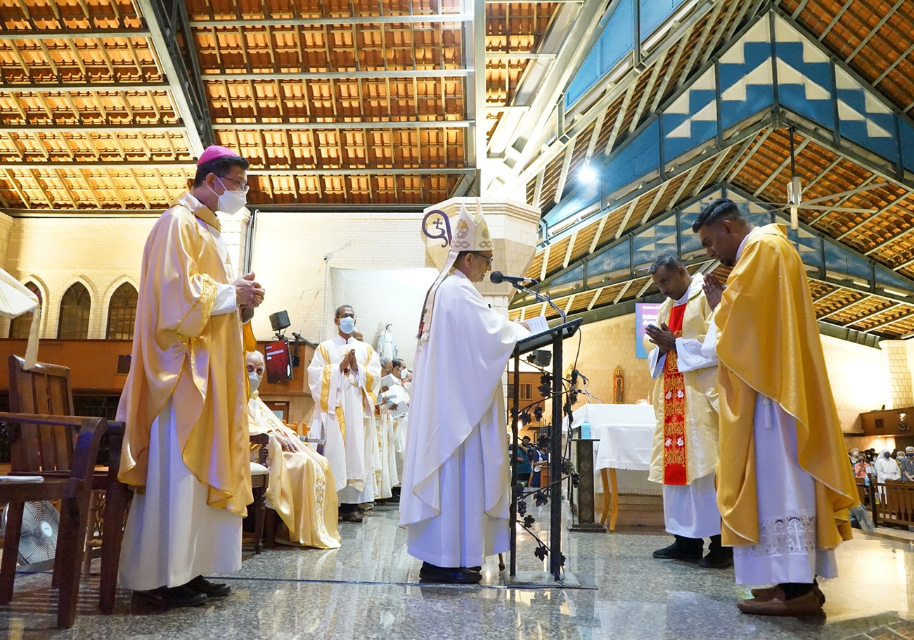 The Bishop of Penang ordains two new priests