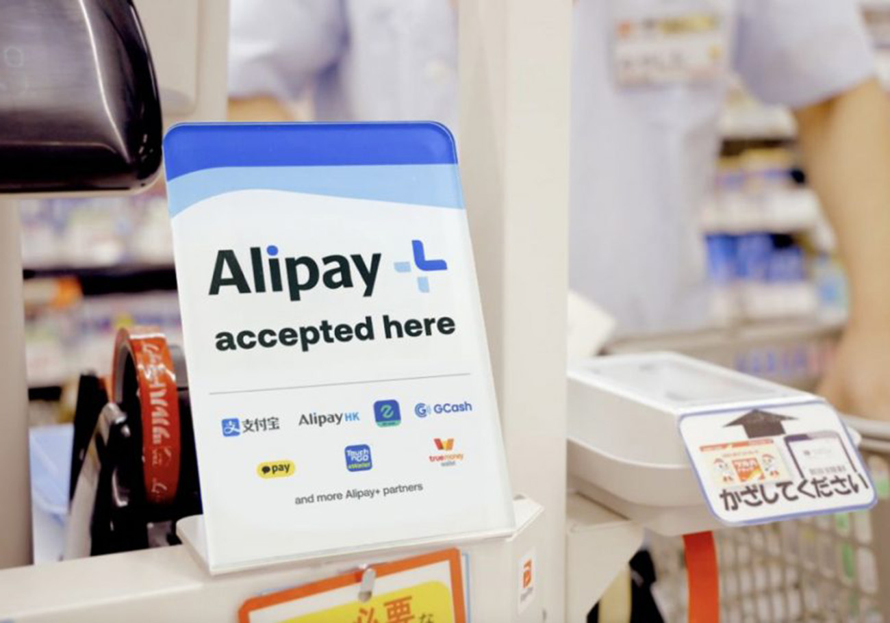 Tourists around the world using Alipay+ mobile payment app seamlessly at various businesses during their travels.