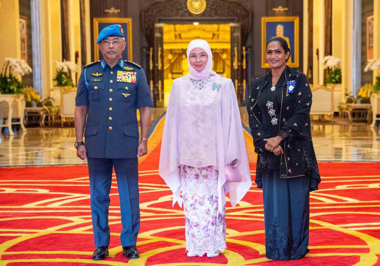 Agong honours security guard Yogeswary for acts of kindness