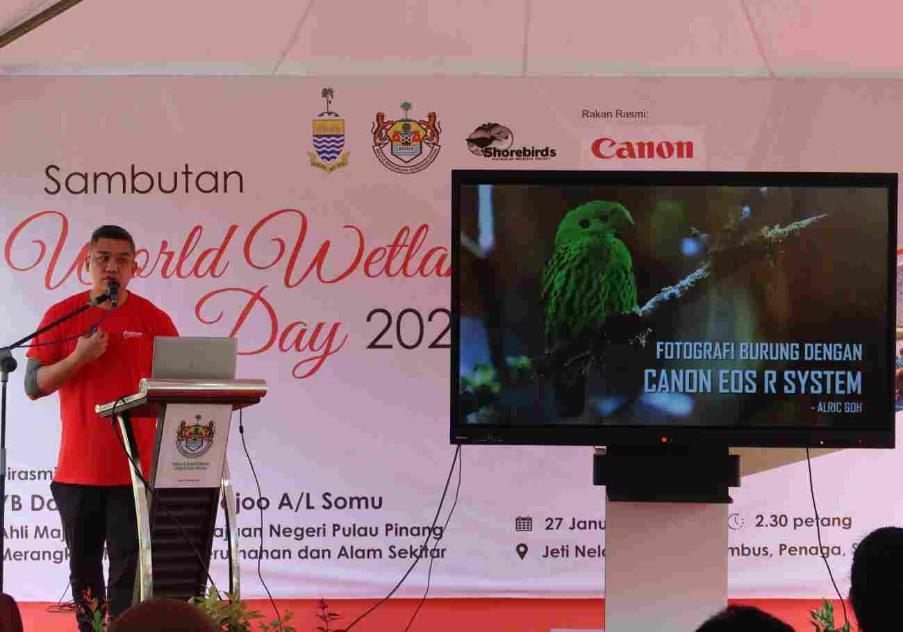 Educational talk on shorebirds at Sungai Tembus event, demonstrating Canon's commitment to conservation education.