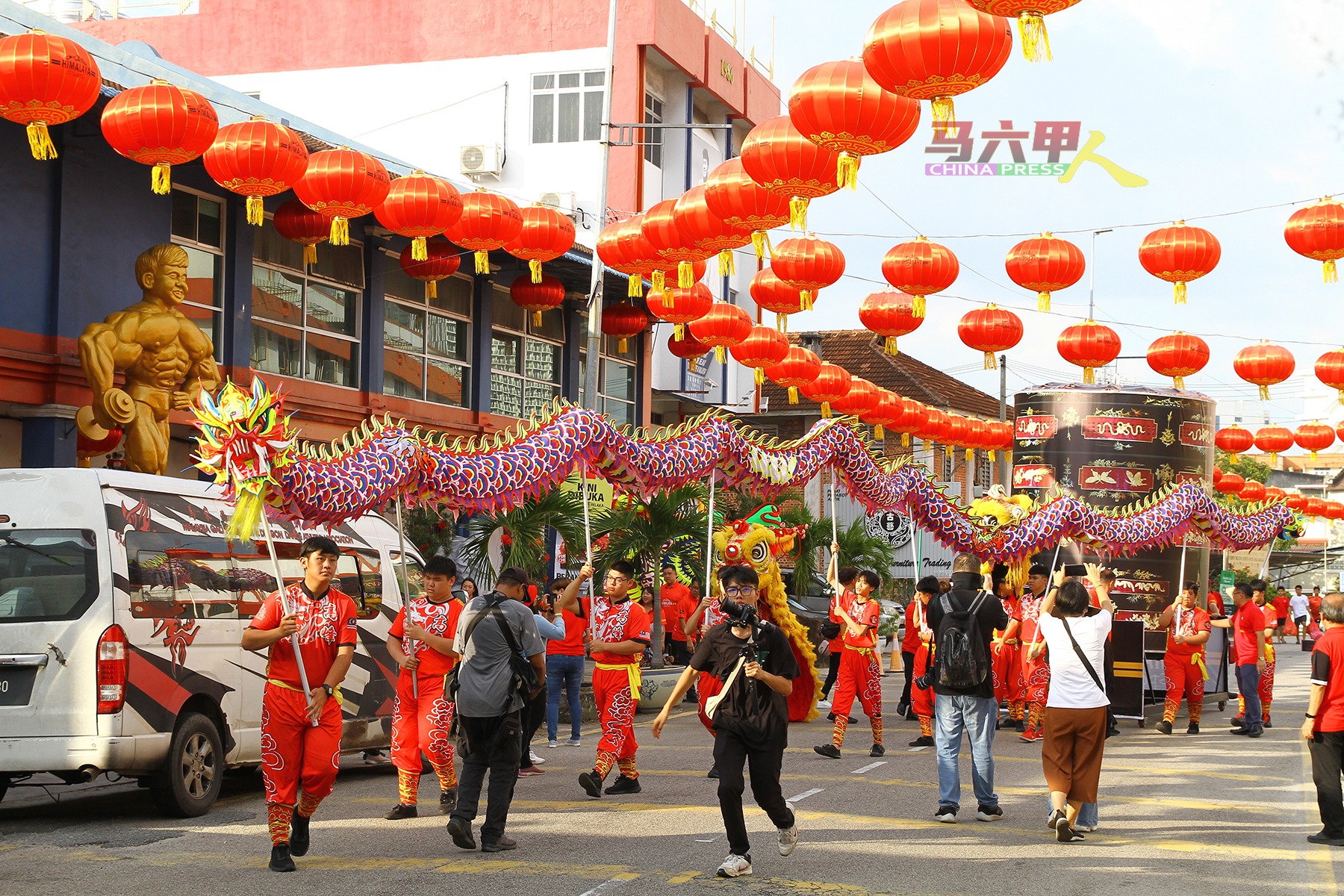 Bustling crowd enjoying the festive atmosphere and cultural performances at the Jonker Walk night market.