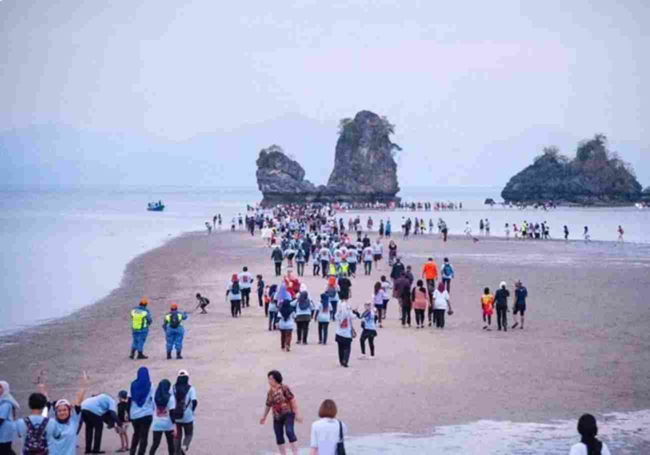 Panoramic view of Tanjung Rhu Beach with the sandbar stretching towards the islands.